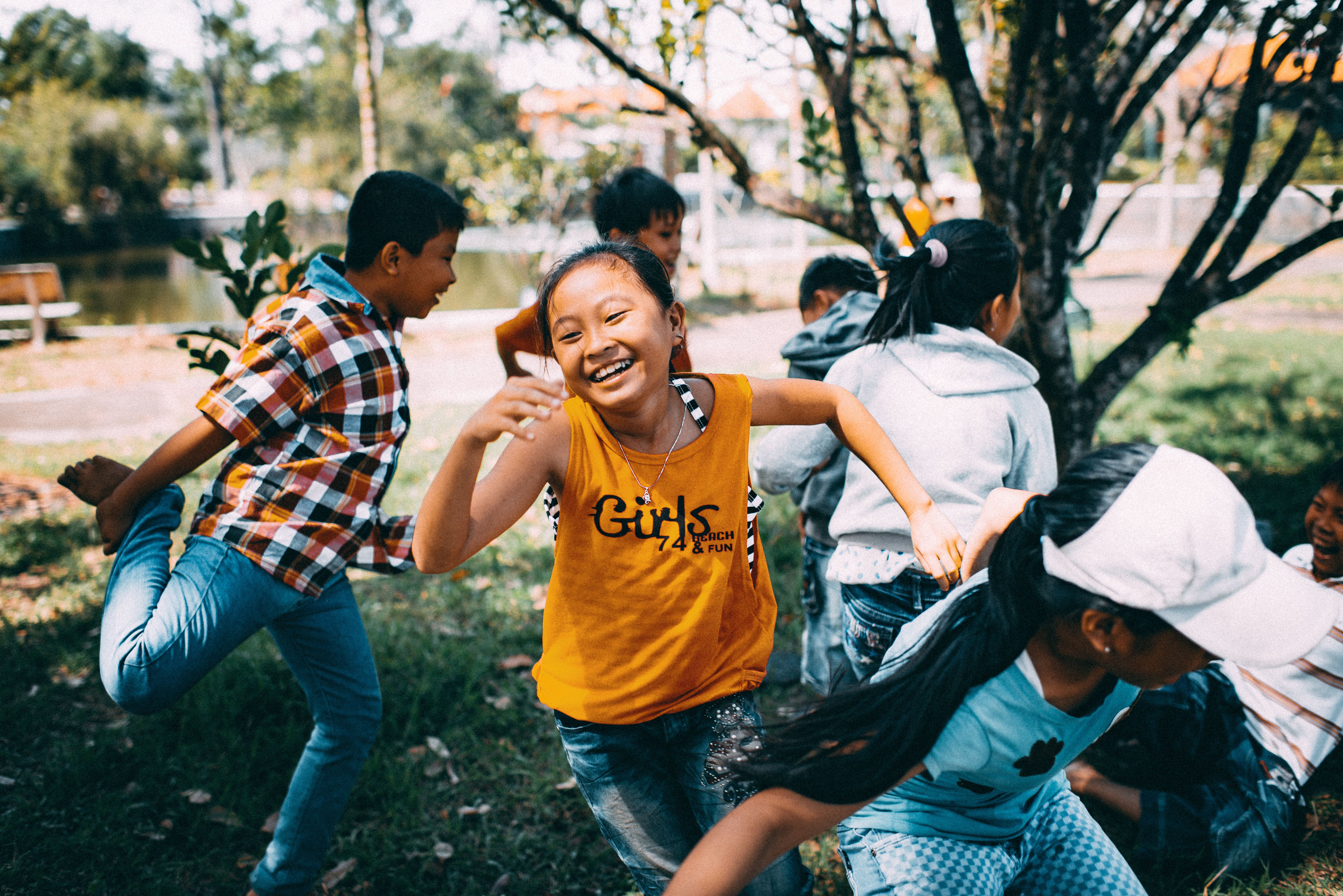 Children laughing and playing together outdoors